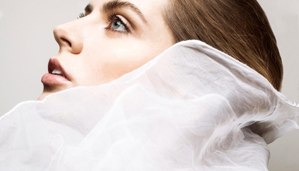 Ethereal beauty wrapped in delicate white fabric