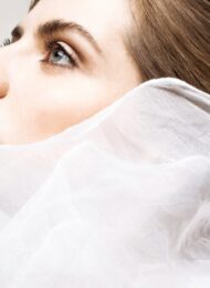 Ethereal beauty wrapped in delicate white fabric